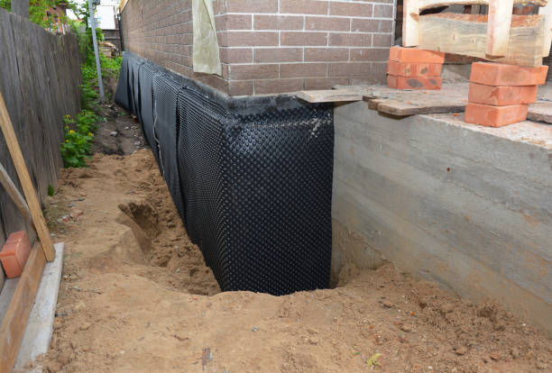 Happy homeowners after waterproofing job in King George